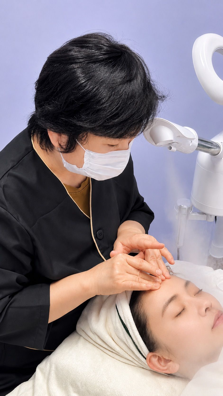 Joanna Tang providing a professional facial treatment
